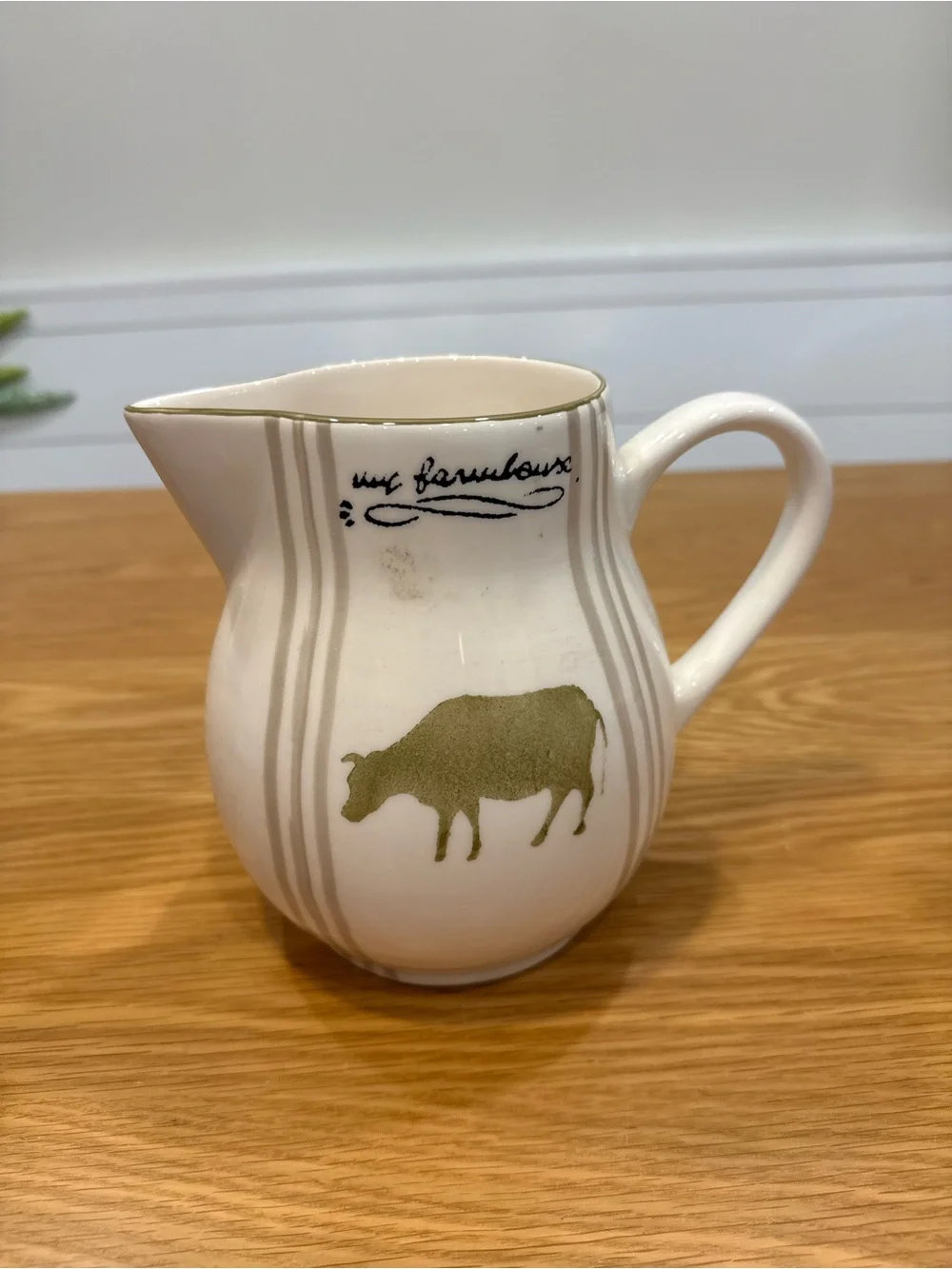 White Ceramic Farmhouse Pitcher with Olive Cow Motif
